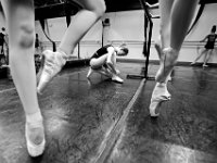 Mia Hurley, 14, ties her pointe shoes as she and her Ballet D class begin warming up before dancing on pointe at the New Bedford Ballet studio on Purchast Street in the north end of New Bedford.   [ PETER PEREIRA/THE STANDARD-TIMES/SCMG ]